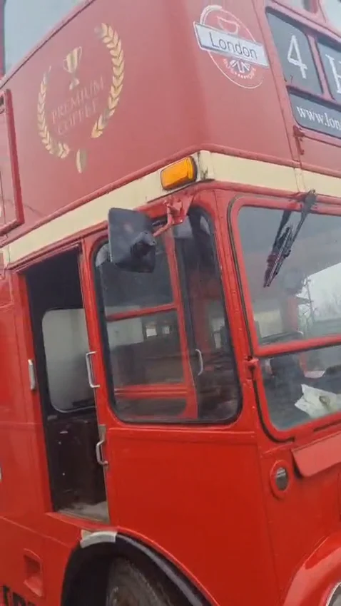 The Premium Coffee crest on the side of the bus