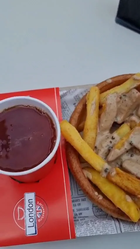 Fries served with a pot of sauce